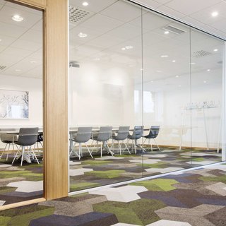 Bolon floor tiles in green, blue, gray and white in the office of Etikhus in Varberg, Sweden.
