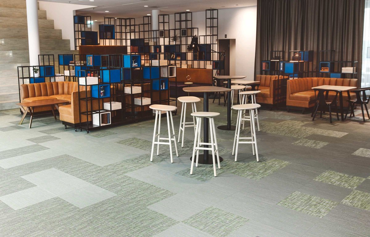 Elegant and tactile woven vinyl floor tiles in the office of Västsvenska Handelskammaren in Gothenburg, Sweden