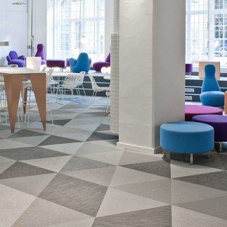 Geometric floor pattern using Bolon Studio™ Triangle tiles in the office of Skype in Stockholm, Sweden