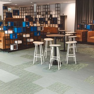 Elegant and tactile woven vinyl floor tiles in the office of Västsvenska Handelskammaren in Gothenburg, Sweden