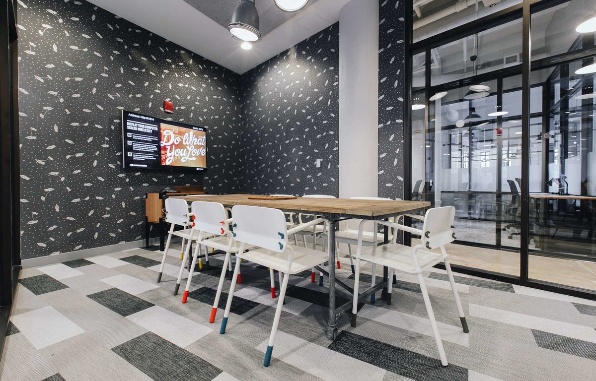 WeWork combines different shapes to create their own unique flooring design.
